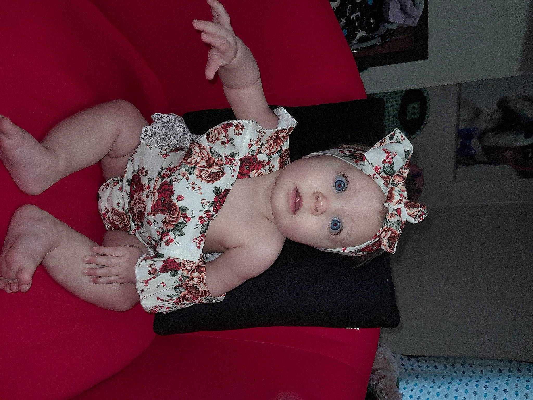 Lizzie is registered to the contest to win money with this photo: baby, baby_toddler_clothing, chest, child, comfort, eye, flash_photography, foot, gesture, happy, headpiece, headwear, human_body, human_leg, knee, leg, nail, person, pink, thigh