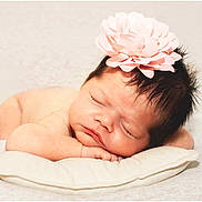 Arabella joined the competition — help win amazing prizes! baby, newborn, sleeping, flower, headband, pillow, soft, peaceful, cute, infant, resting, skin, face, hand, closeup, portrait, adorable, peace, calm, blanket