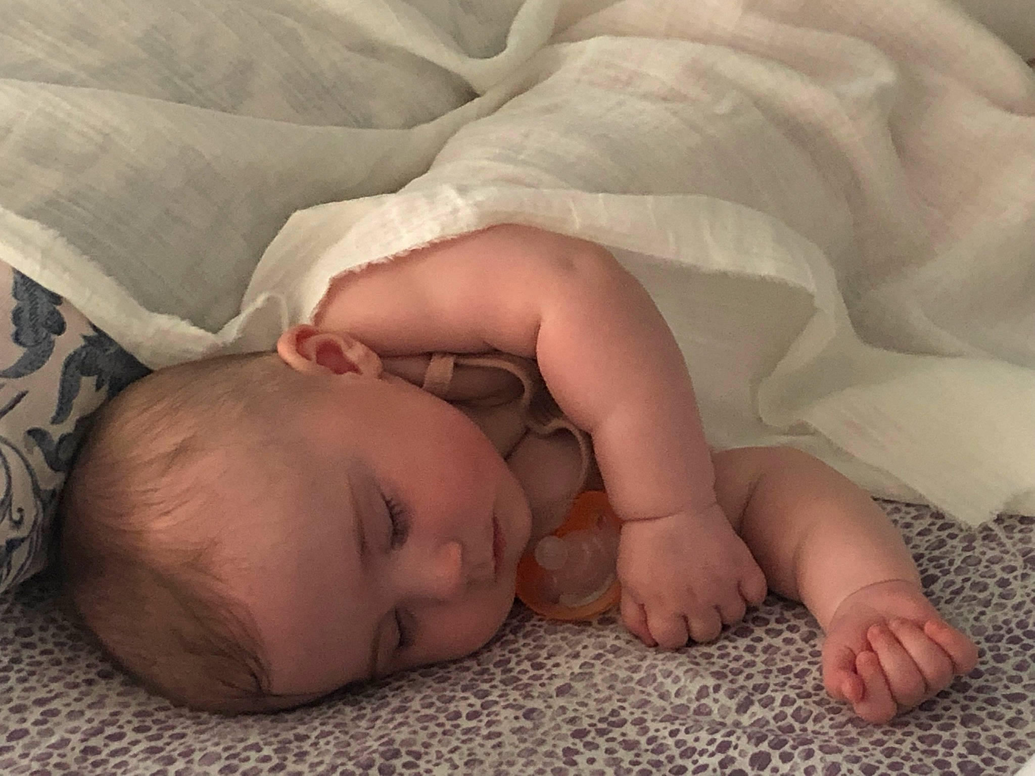 Ella is registered to the contest to win money with this photo: baby, baby_toddler_clothing, bedtime, cheek, child, comfort, eye, finger, flesh, gesture, hand, head, human_body, linens, mouth, nail, person, skin, textile, thumb