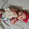 Zoe is registered to the contest to win money with this photo: adorable, baby, blanket, child, cloth, comfort, cute, eyes, face, floral_pattern, hand, headband, indoors, infant, lying_down, red_headband, skin, soft_texture, swimsuit, toddler