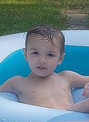 Dawson is registered to the contest to win money with this photo: baby, barechested, bathing, chest, child, composite_material, eye, face, fun, happy, head, leisure, leisure_centre, nonbuilding_structure, person, recreation, summer, swimming_pool, toddler, vacation