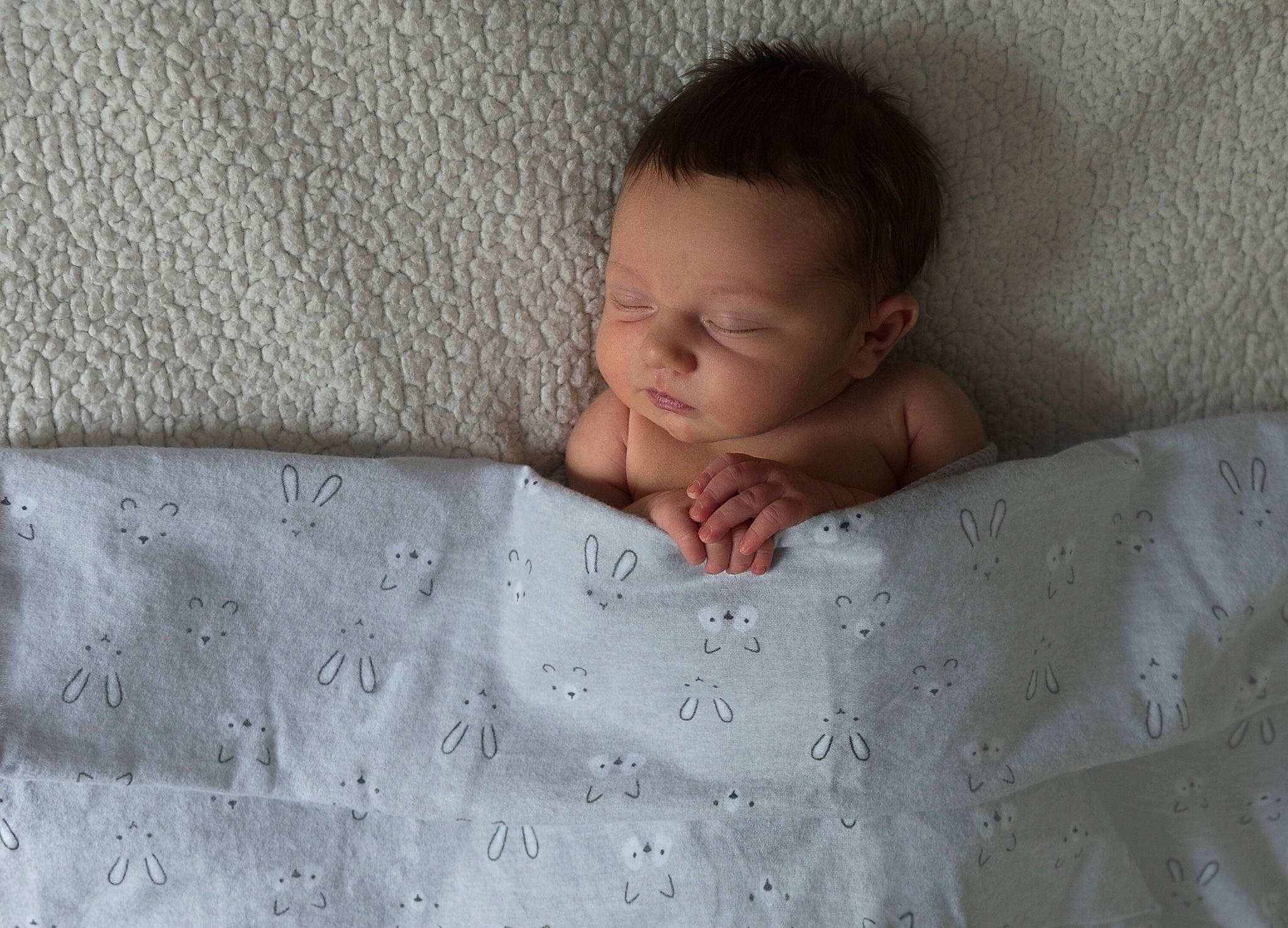 Samson joined the competition — help win amazing prizes! baby, baby_toddler_clothing, bedding, bedtime, child, chin, comfort, flooring, grass, grey, linens, pattern, person, portrait_photography, room, sitting, skin, sleeve, textile, toddler
