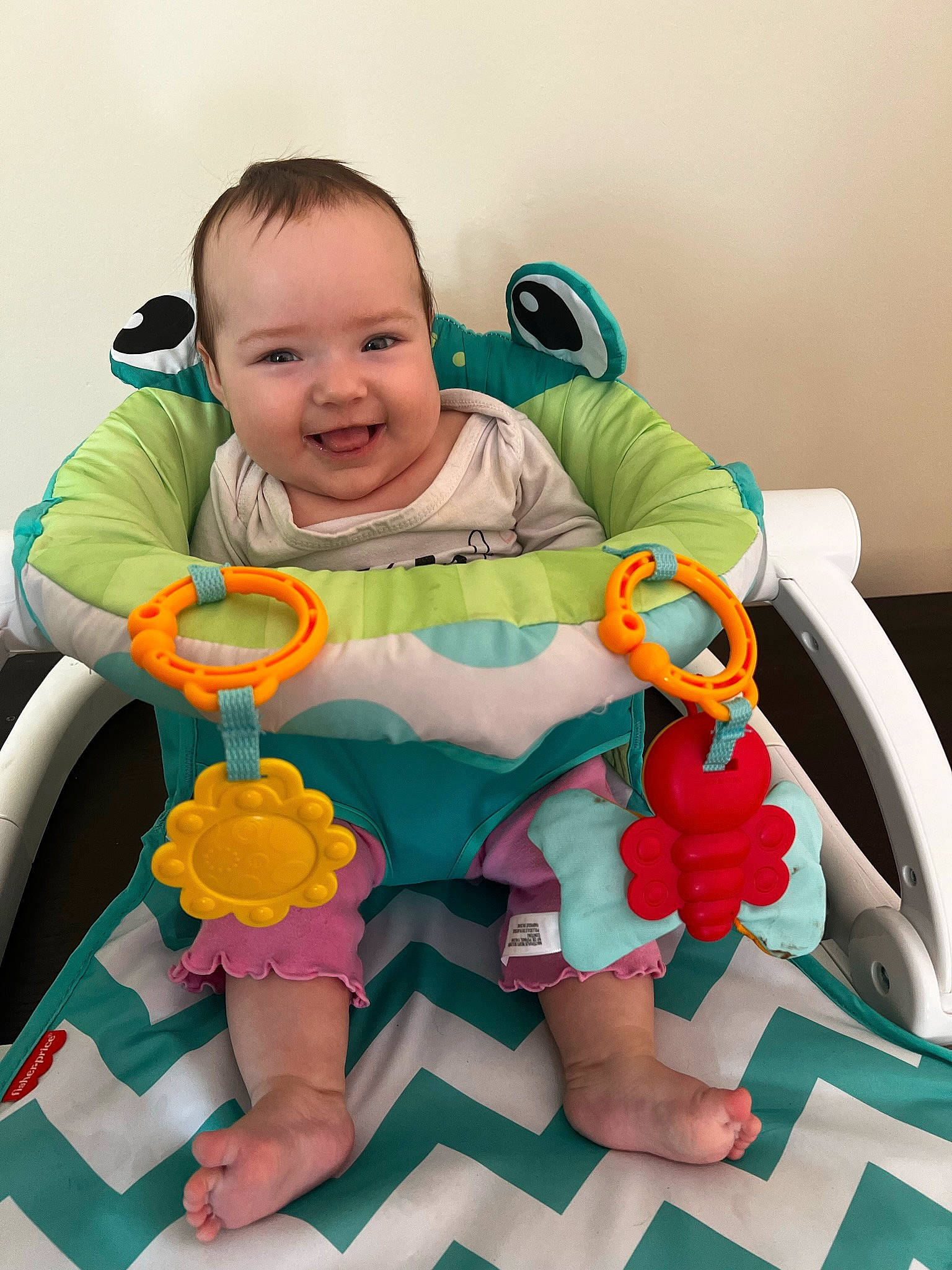 Nyla is registered to the contest to win money with this photo: baby, baby_playing_with_toys, baby_products, baby_safety, baby_toddler_clothing, chair, child, comfort, eye, facial_expression, fun, happy, joy, leisure, person, product, shorts, skin, sleeve, smile