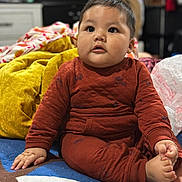 Benjamin joined the competition — help win amazing prizes! baby, child, infant, sitting, indoors, blanket, clothing, foot, hand, face, cheeks, expression, furniture, room, soft, warm, cute, portrait, young, cozy