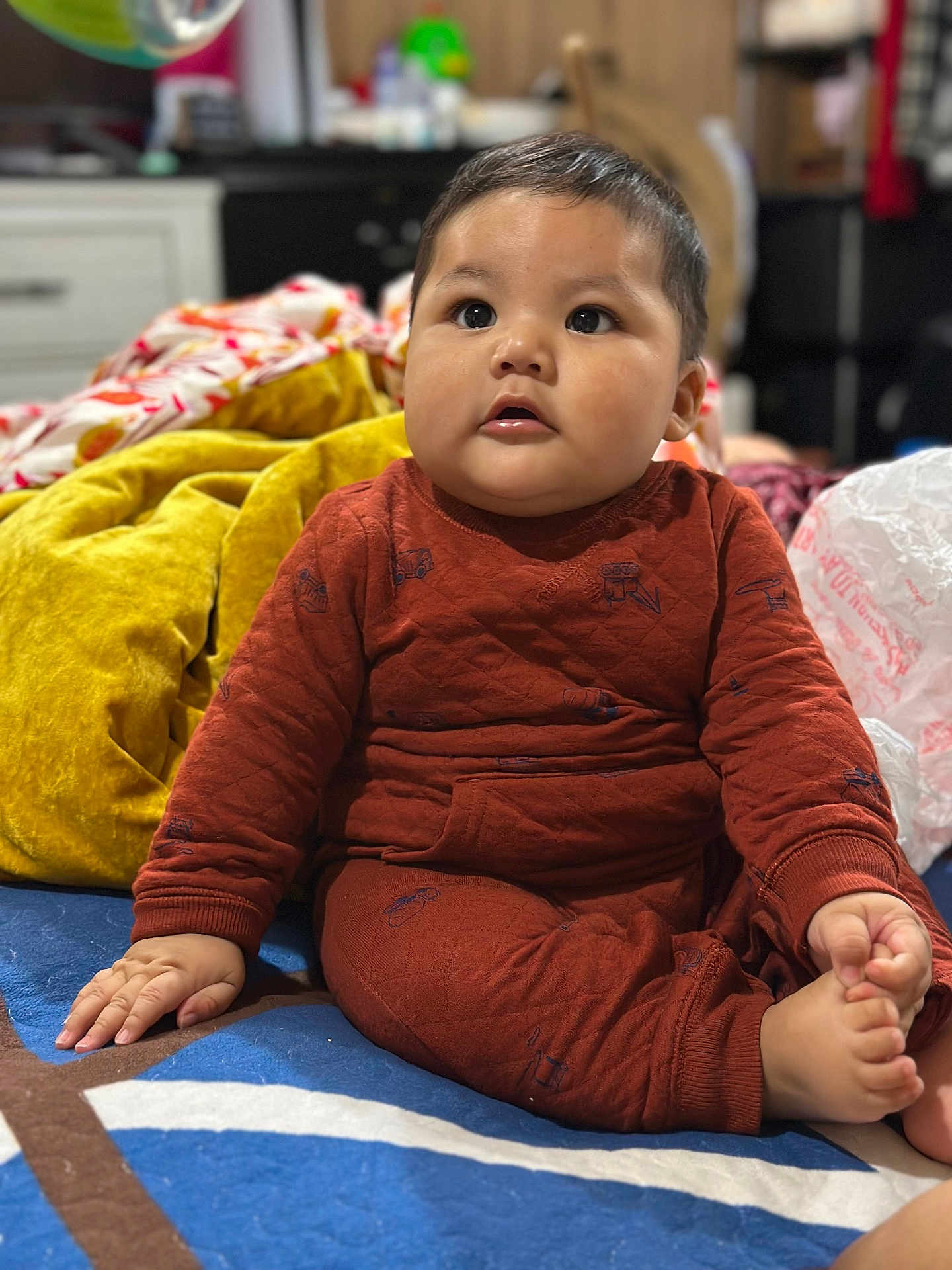 Benjamin joined the competition — help win amazing prizes! baby, child, infant, sitting, indoors, blanket, clothing, foot, hand, face, cheeks, expression, furniture, room, soft, warm, cute, portrait, young, cozy