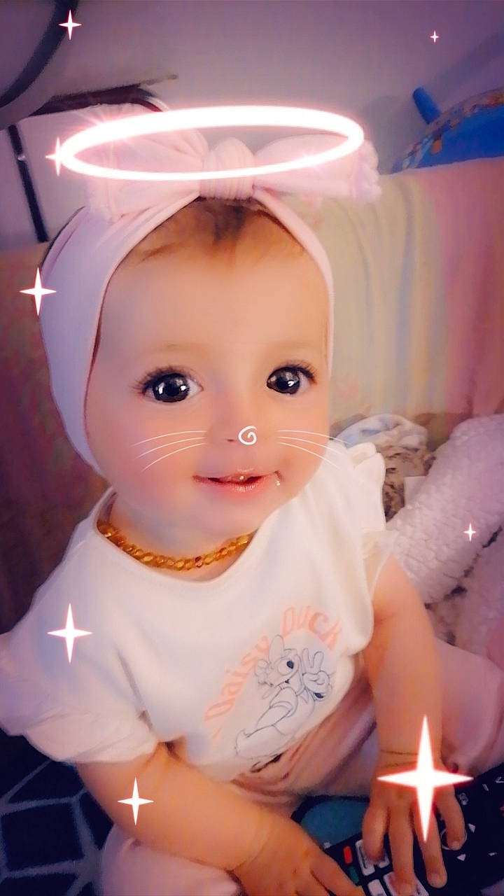 Kaylia participe au concours pour gagner de l'argent avec cette photo : baby, baby_toddler_clothing, candle, cheek, child, doll, dress, eyebrow, eyelash, fashion_accessory, fire, fun, happy, iris, magenta, peach, person, pink, skin, toddler