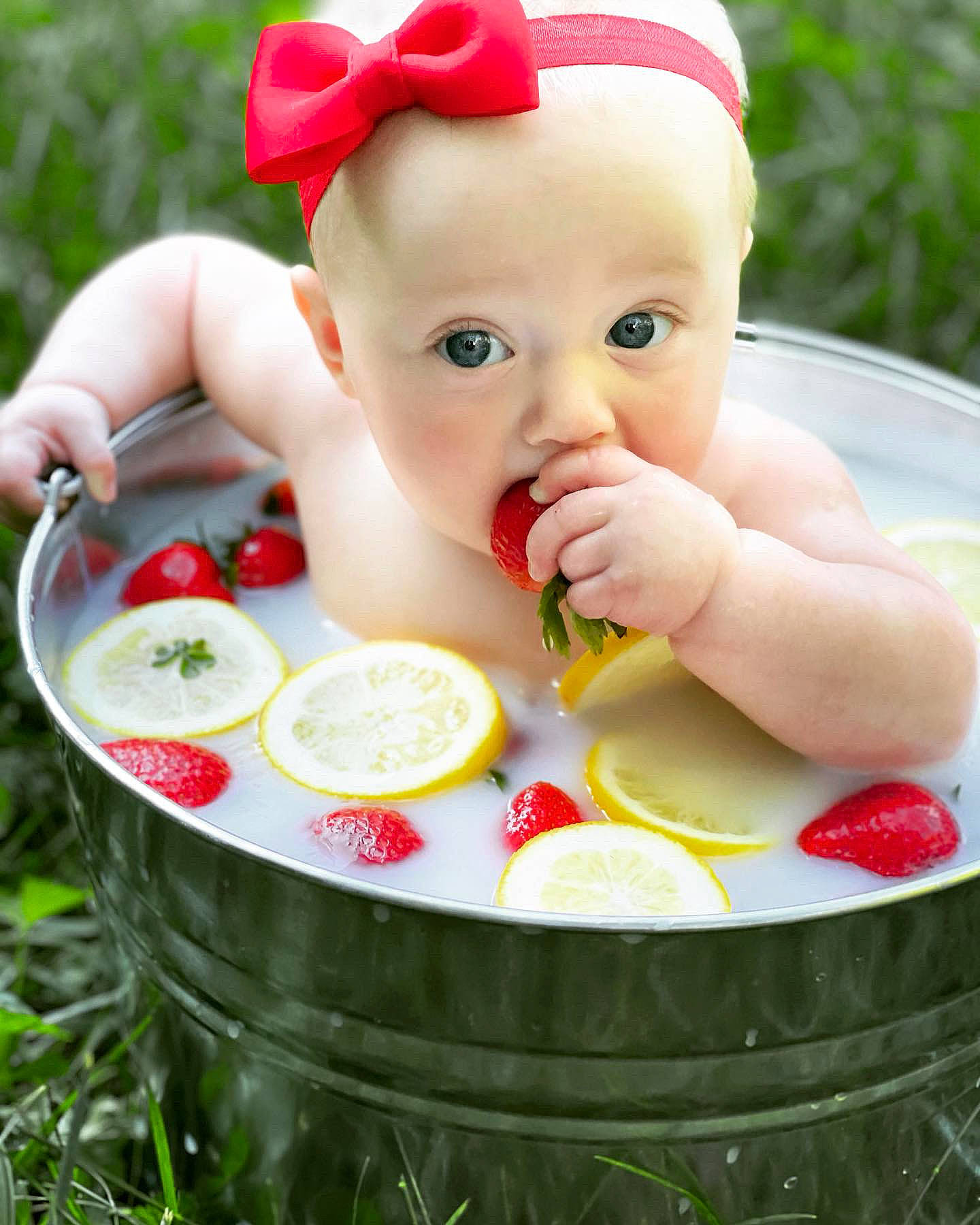 Austyn is registered to the contest to win money with this photo: baby, baby_playing_with_toys, baby_products, baby_toddler_clothing, cap, cheek, child, eye, fictional_character, food, fruit, grass, happy, lip, natural_foods, people_in_nature, person, plant, skin, sweetness