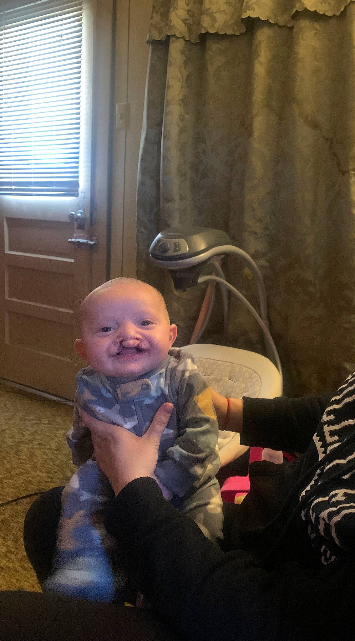 Noah joined the competition — help win amazing prizes! baby, baby_toddler_clothing, chair, cheek, child, comfort, curtain, finger, flooring, fun, happy, joy, mouth, person, room, sitting, smile, thumb, toddler, window