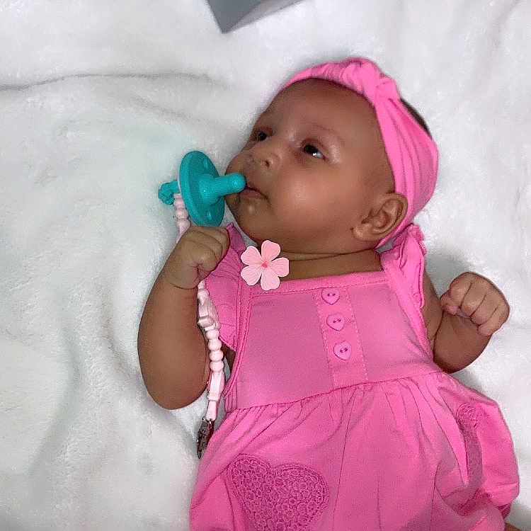 Ra Ziyah joined the competition — help win amazing prizes! baby, infant, pink_dress, headband, pacifier, blanket, age_blocks, lying_down, cute, child, newborn, soft_texture, portrait, indoors, young_child, adorable, milestone, celebration, peaceful, baby_girl