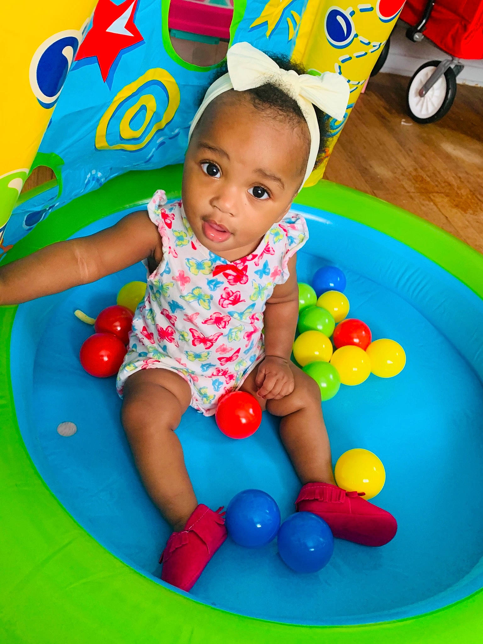 Karizma joined the competition — help win amazing prizes! baby_playing_with_toys, baby_toddler_clothing, ball, chair, child, face, facial_expression, fun, green, happy, head, human_settlement, leisure, person, recreation, red, summer, t_shirt, toddler, white