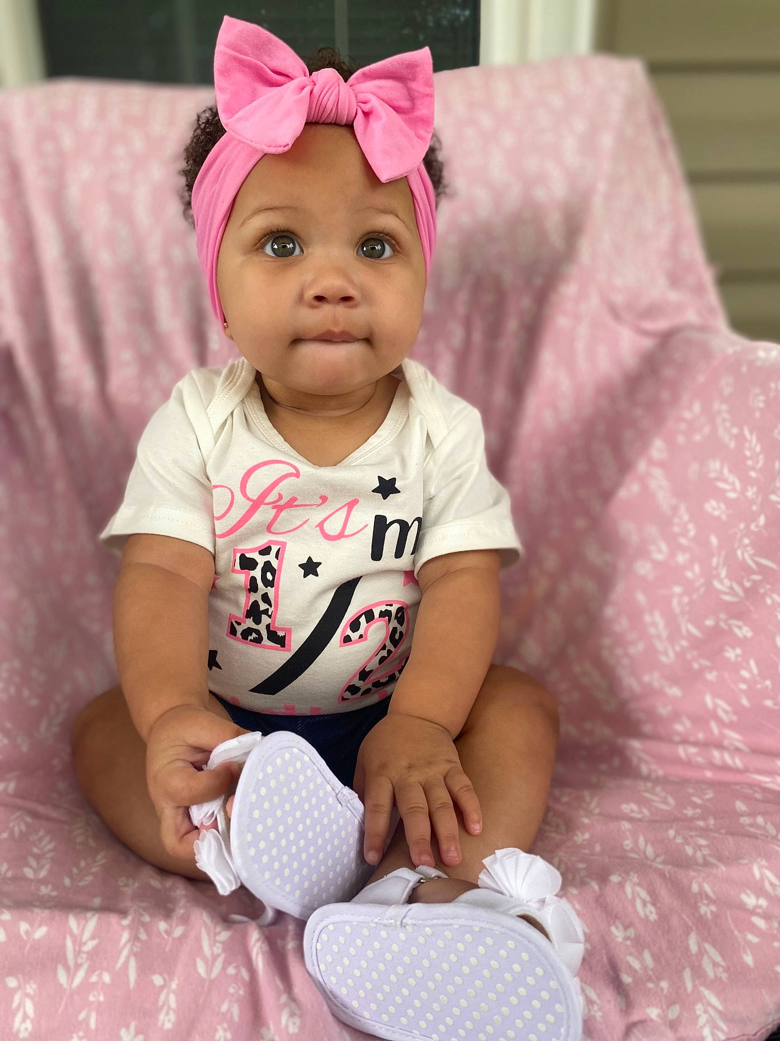 Jaylani is registered to the contest to win money with this photo: baby, baby_toddler_clothing, cap, cheek, child, comfort, costume_hat, face, fun, happy, head, headgear, headwear, magenta, person, pink, purple, skin, sleeve, smile