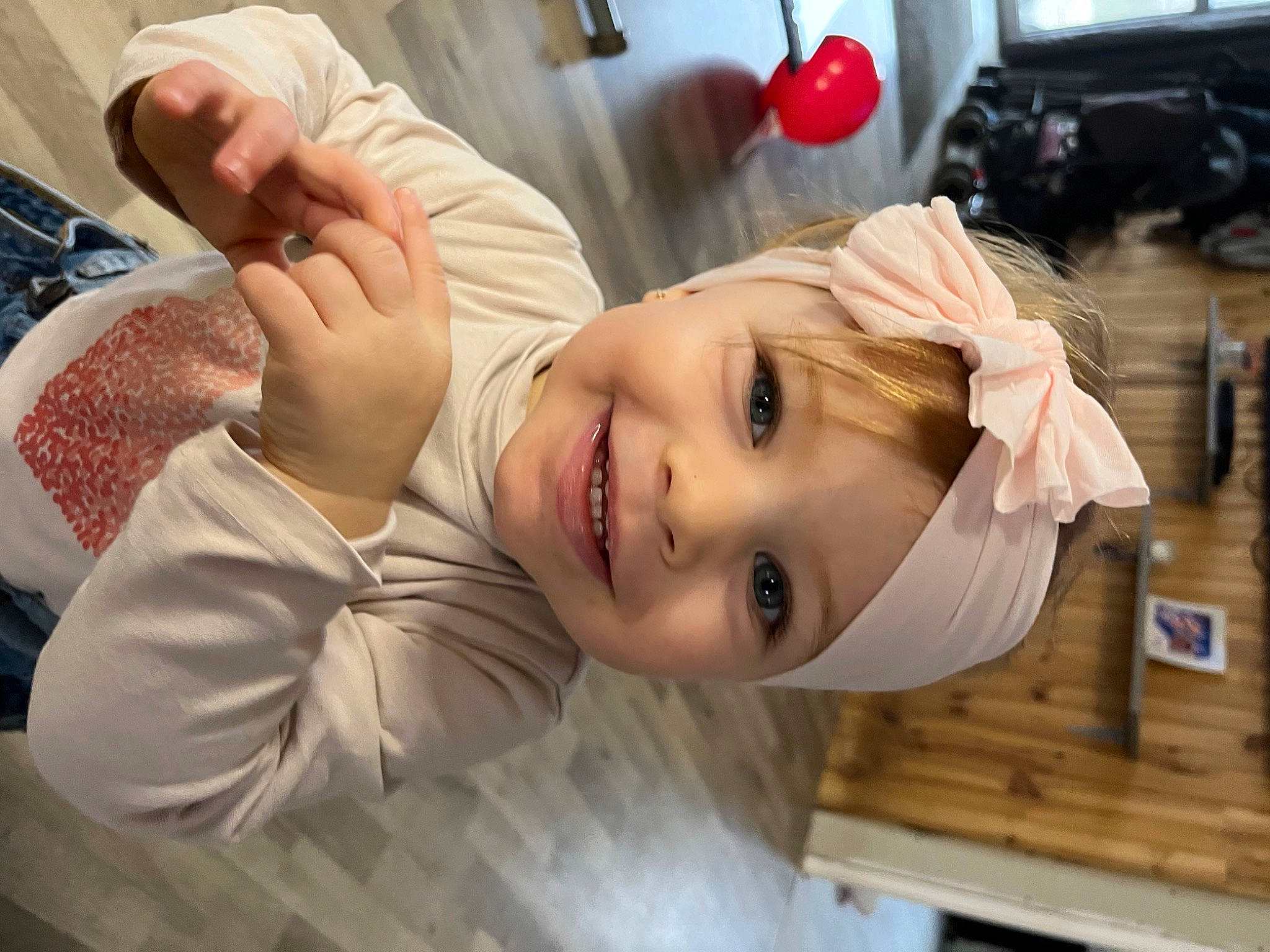 Lyana participe au concours pour gagner de l'argent avec cette photo : baby, chest, child, dress, eyebrow, eyelash, face, fun, gesture, happy, headwear, joy, lip, mouth, nail, neck, nose, person, room, skin