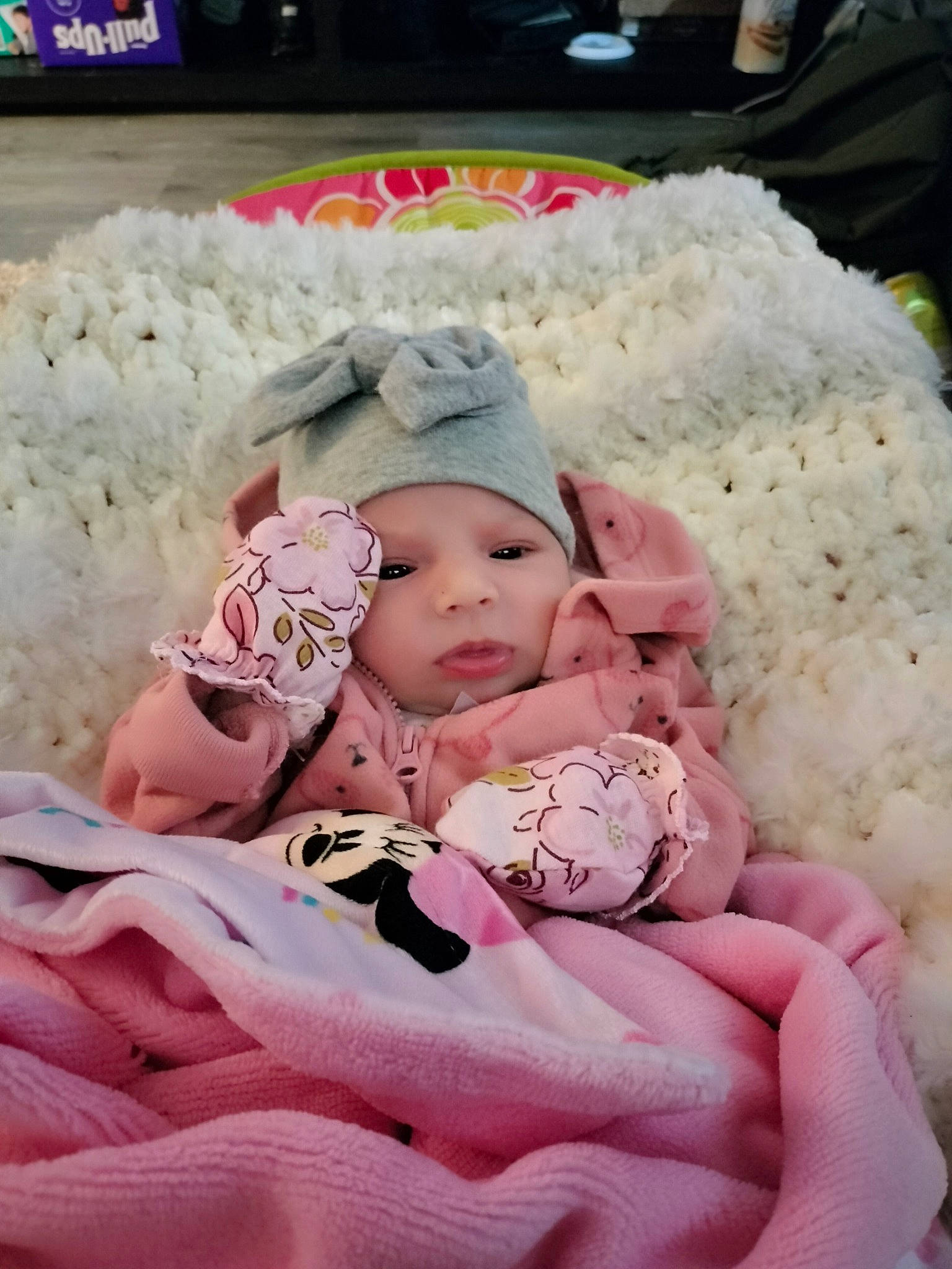 Jazmine is registered to the contest to win money with this photo: baby, baby_products, baby_sleeping, baby_toddler_clothing, beanie, cheek, child, comfort, dress, event, fur, happy, hat, headwear, linens, magenta, person, pink, sitting, skin