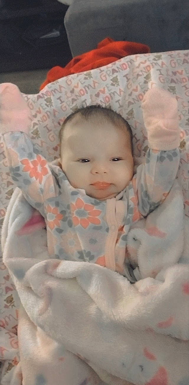 Jazmine is registered to the contest to win money with this photo: baby, baby_products, baby_safety, baby_toddler_clothing, cheek, child, comfort, face, fur, linens, lip, pattern, peach, person, portrait_photography, product, sitting, skin, sleeve, textile