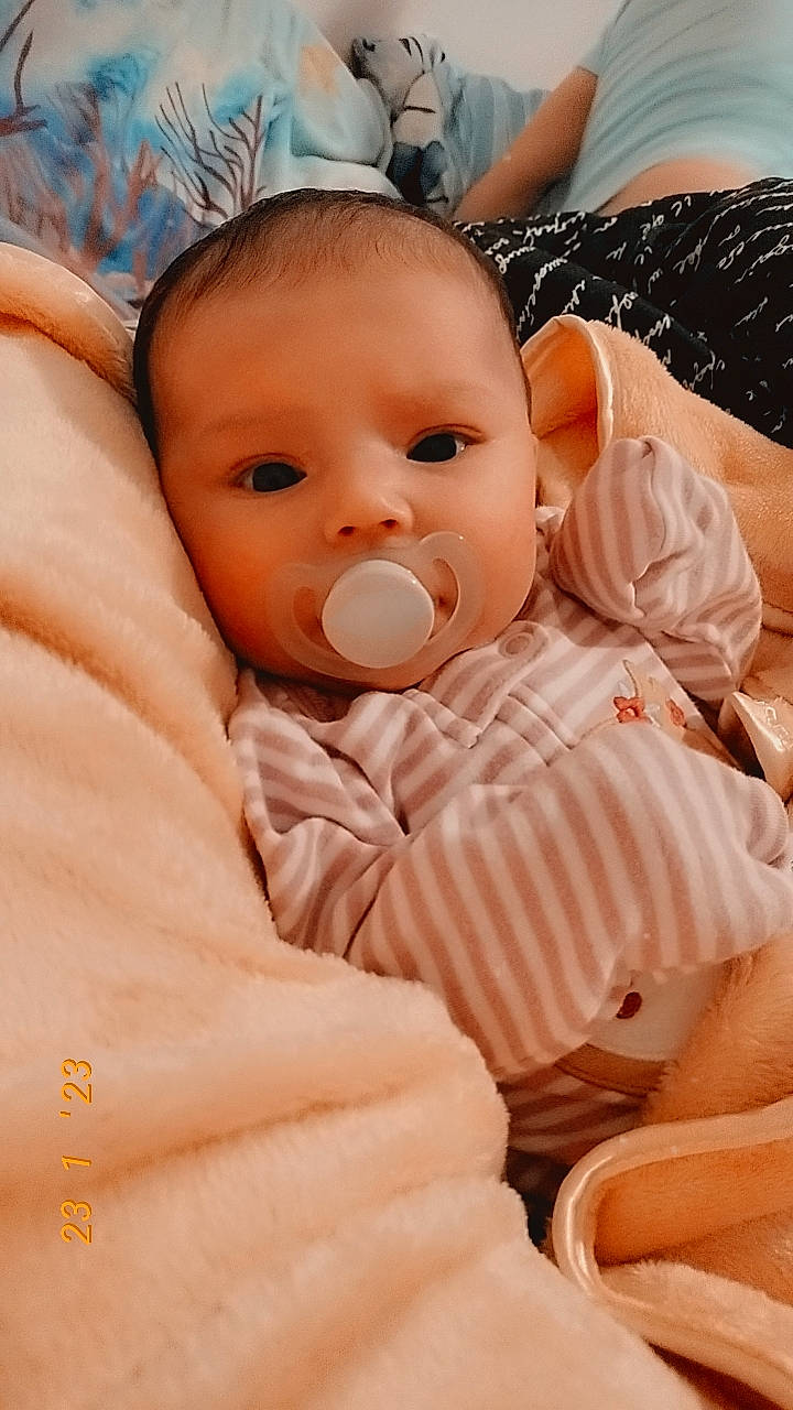 Jazmine joined the competition — help win amazing prizes! baby, baby_sleeping, baby_toddler_clothing, cheek, child, comfort, eye, eyelash, happy, human_body, iris, linens, lip, mouth, nose, peach, person, skin, sleeve, thumb