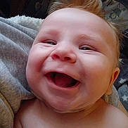 Jayce joined the competition — help win amazing prizes! baby, smiling, close_up, face, joyful, infant, skin, hair, blanket, indoors, happy, cute, child, person, portrait, expression, cheerful, young, head, mouth_open