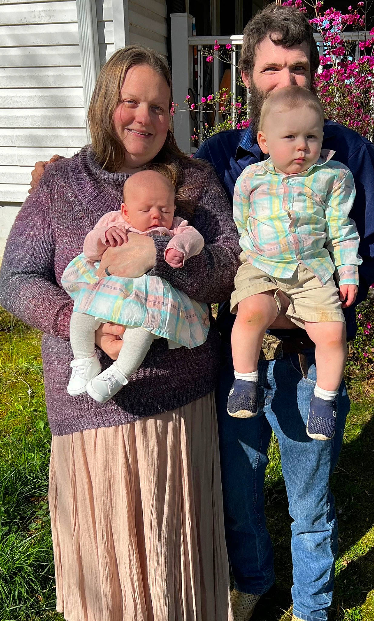 Novalee is registered to the contest to win money with this photo: baby, baby_toddler_clothing, child, event, eye, face, fun, grass, happy, interaction, iris, joy, lap, people, people_in_nature, person, sitting, skin, smile, standing