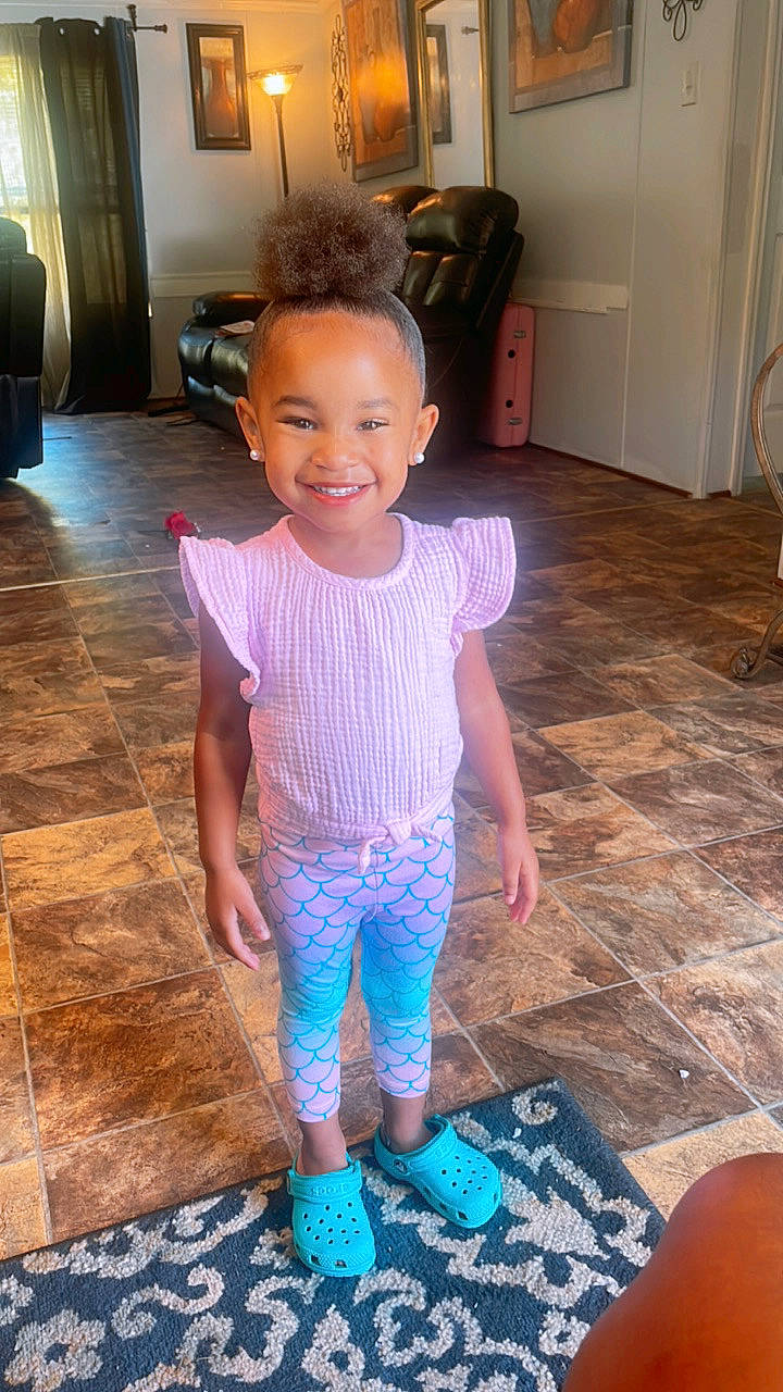 Alaiyah joined the competition — help win amazing prizes! baby, baby_toddler_clothing, cabinetry, child, drawer, electric_blue, floor, flooring, fun, happy, hardwood, human_leg, joy, laminate_flooring, person, pink, purple, sleeve, smile, t_shirt