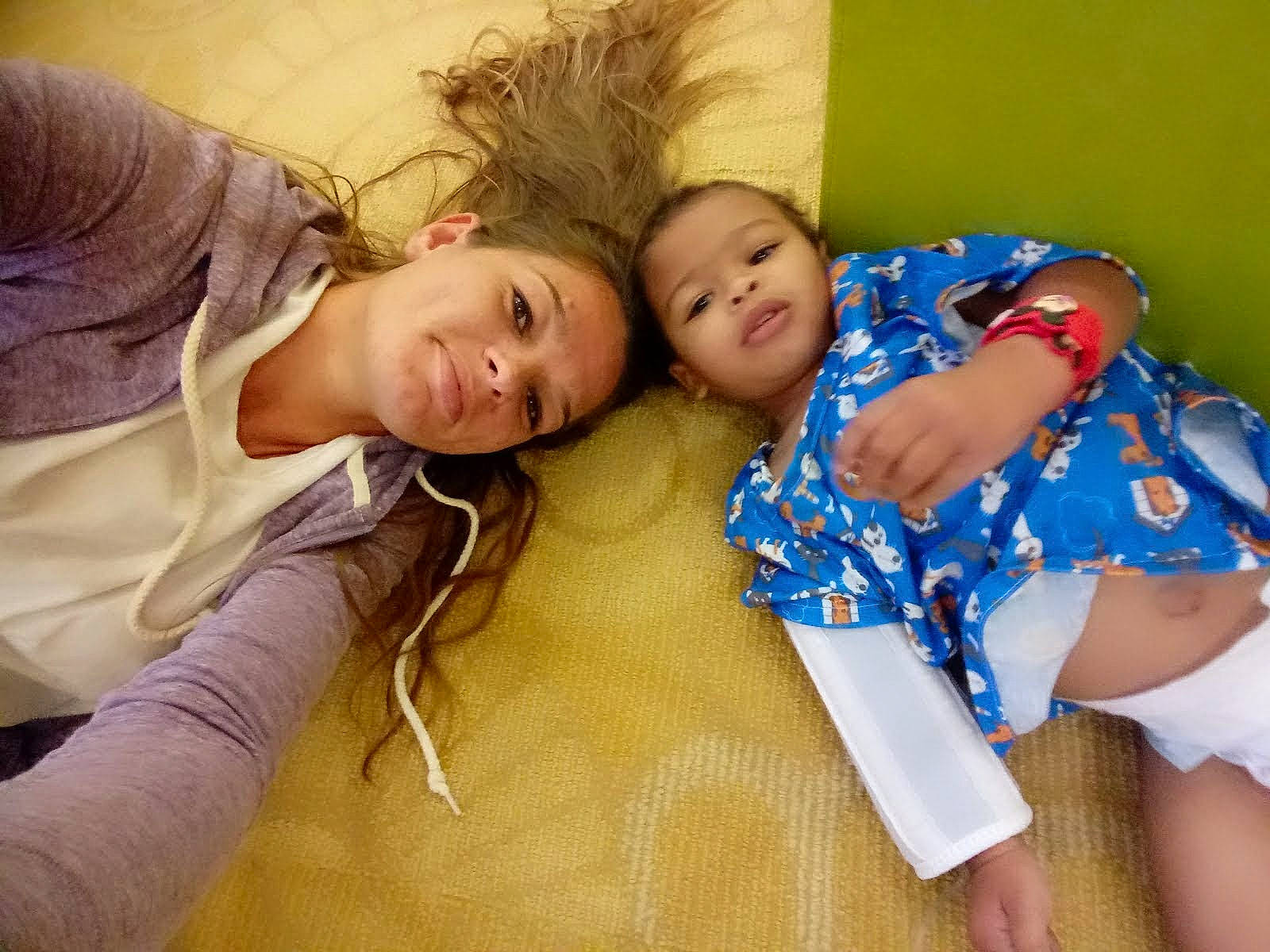 Malachi is registered to the contest to win money with this photo: abdomen, baby_toddler_clothing, child, comfort, couch, fun, happy, human_leg, iris, person, room, sibling, sitting, skin, smile, t_shirt, thigh, toddler, trunk, vacation