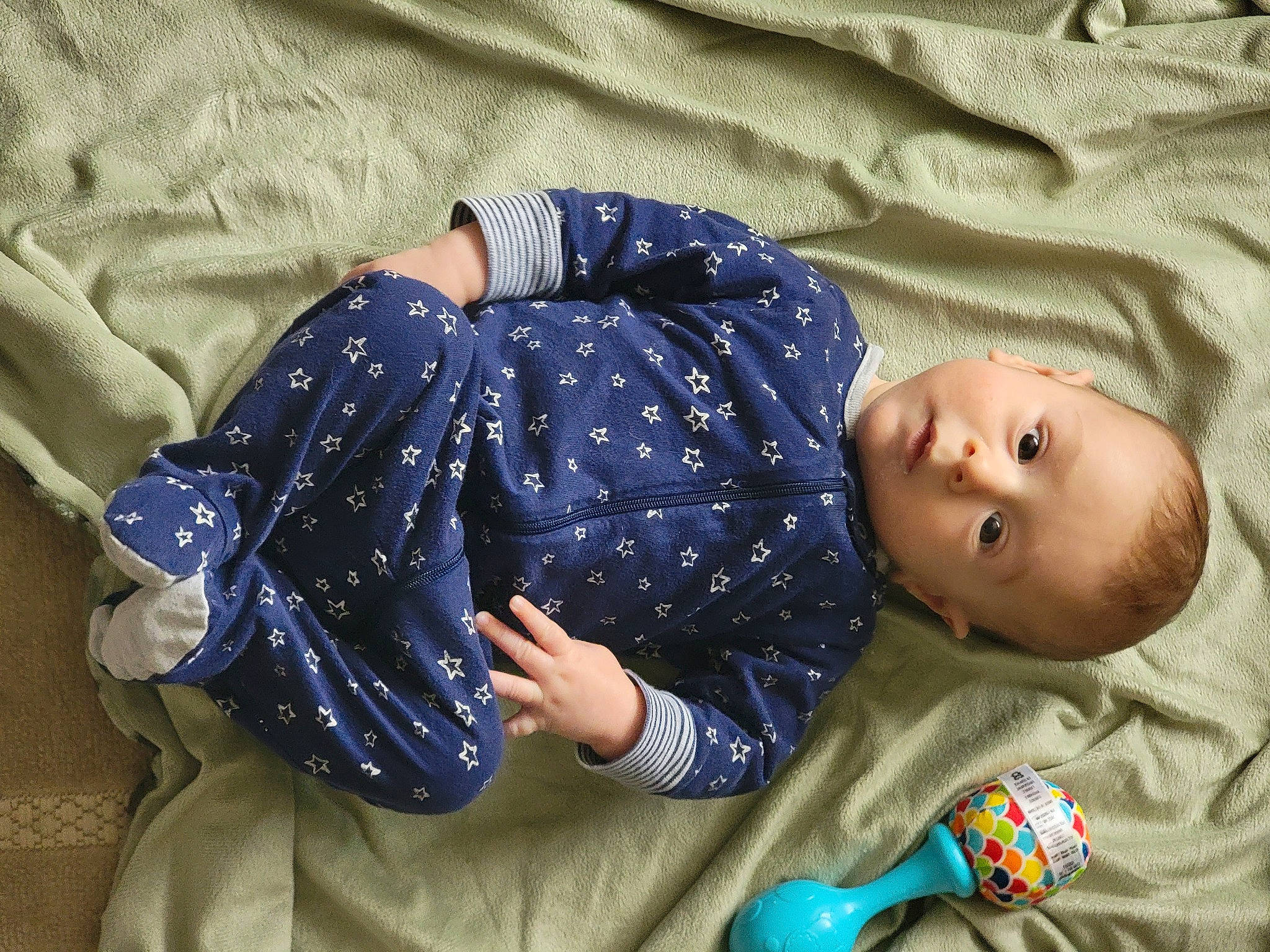 Henry joined the competition — help win amazing prizes! baby, baby_toddler_clothing, bedding, bedtime, blue, child, comfort, elbow, electric_blue, face, grass, human_leg, linens, nap, pattern, person, sitting, sleep, sleeve, t_shirt