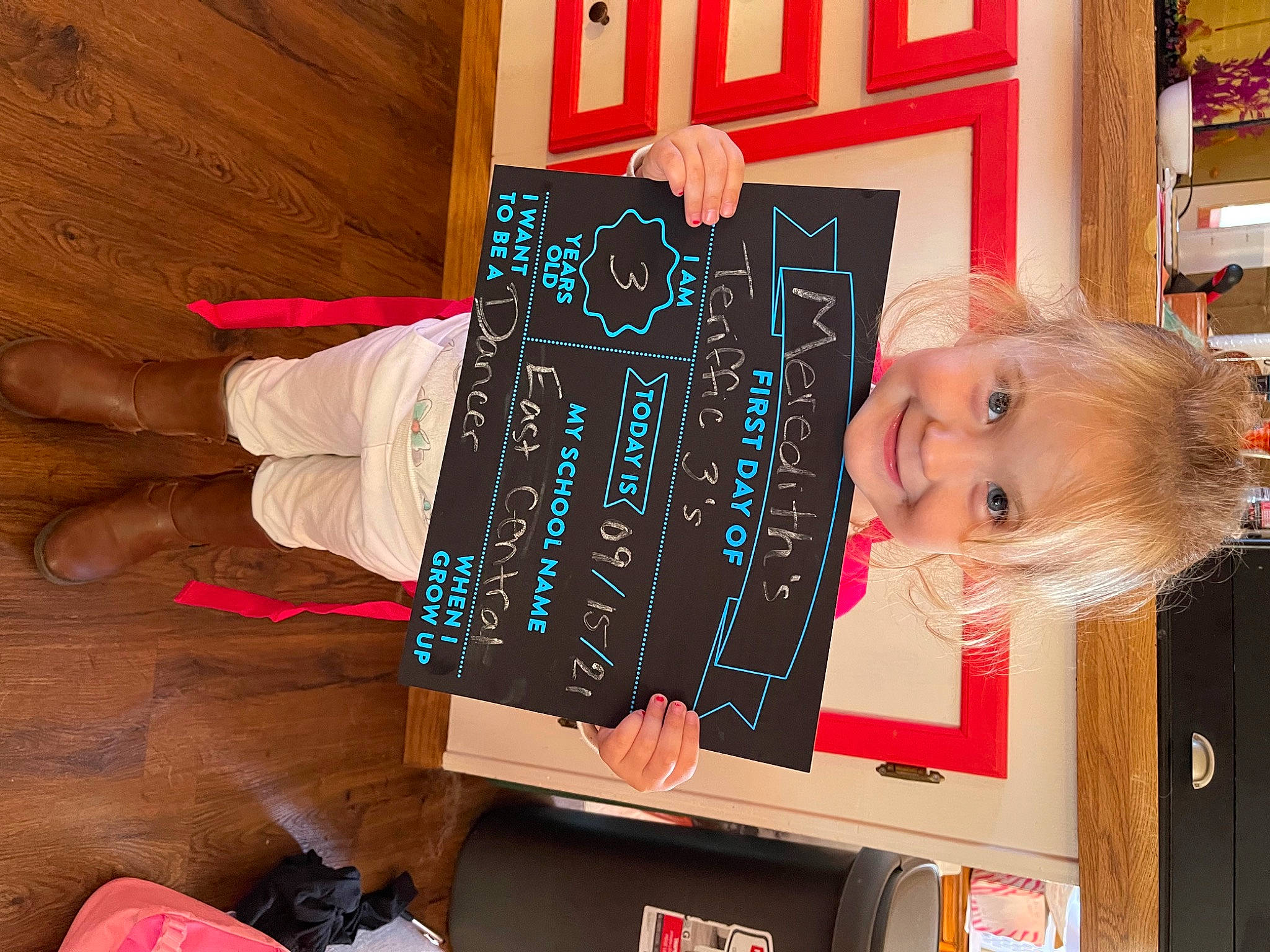 Meredith joined the competition — help win amazing prizes! art, artist, blackboard, carmine, child, flooring, fun, hardwood, joy, pattern, person, play, publication, red, room, shelf, shelving, smile, t_shirt, visual_arts