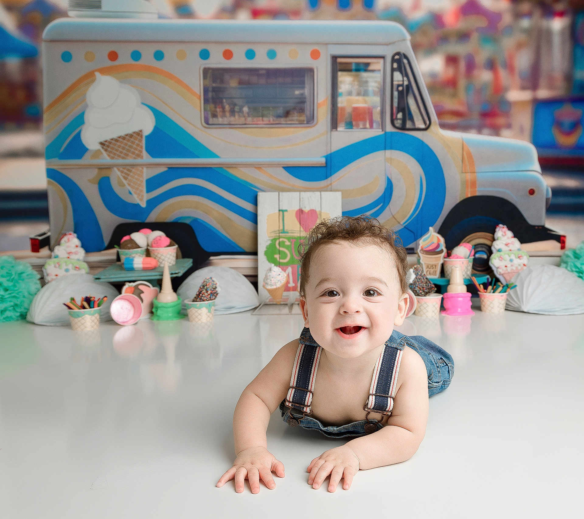 Wolftyn joined the competition — help win amazing prizes! baby, child, smiling, denim_overalls, ice_cream, toy, background, colorful, happy, face, cute, playful, table, indoor, decorations, summer, food_theme, portrait, infant, studio_photo