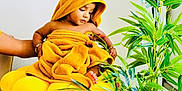 Prabhu joined the competition — help win amazing prizes! arm, baby, basket, child, childwearing, colorful, cozy, curious, cute, exploring, foot, greenery, hand, home, indoor, plant, portrait, towel, woven_basket, yellow