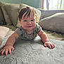 Jameson joined the competition — help win amazing prizes! baby, child, crawling, smiling, indoor, couch, pillow, blanket, plush_surface, window, sunlight, hair, face, hand, clothing, happy, person, living_room, soft_texture, cute