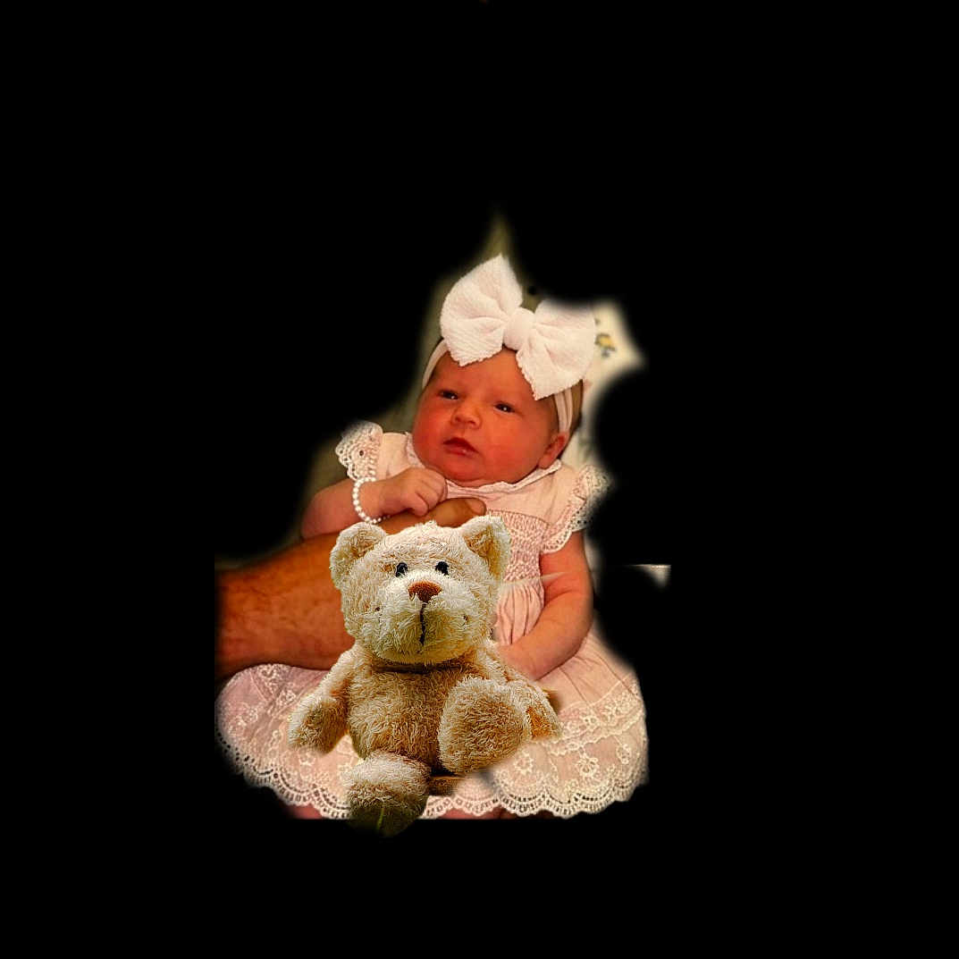 Kaitlyn is registered to the contest to win money with this photo: baby, infant, child, portrait, sitting, pink_dress, bow, headband, teddy_bear, stuffed_animal, toy, lace, frills, blank_background, dark_background, indoor, close_up, face, photography, adorable