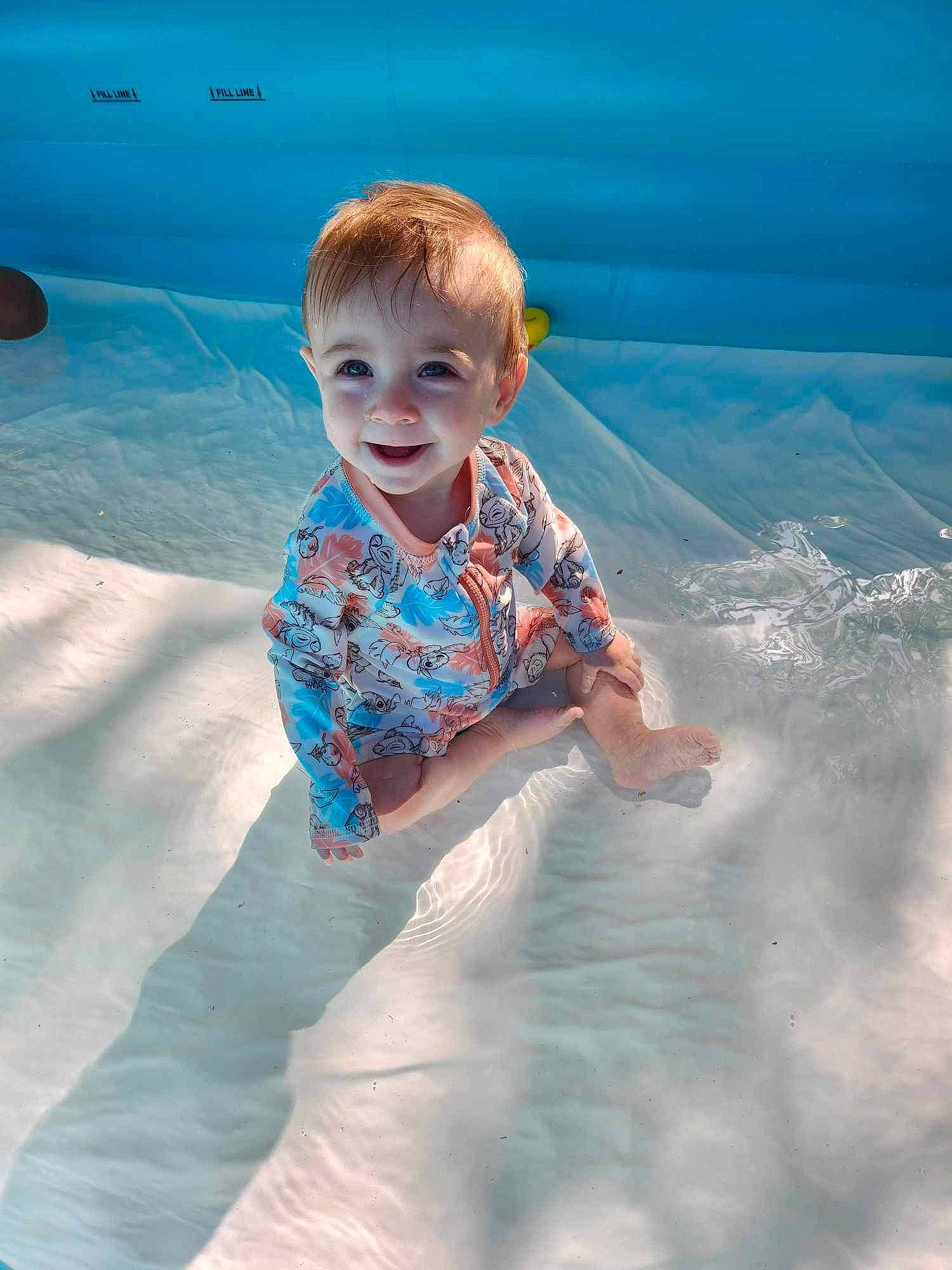 Oceana joined the competition — help win amazing prizes! baby, baby_toddler_clothing, barefoot, child, electric_blue, fun, happy, leisure, ocean, pattern, people_in_nature, person, play, recreation, sand, sitting, sleeve, smile, t_shirt, toddler