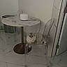 cat, chair, table, marble, floor, tile, modern, minimalist, indoor, pet, furniture, white, gray, fluffy, relaxed, domestic, animal, transparent_chair, home, cozy
