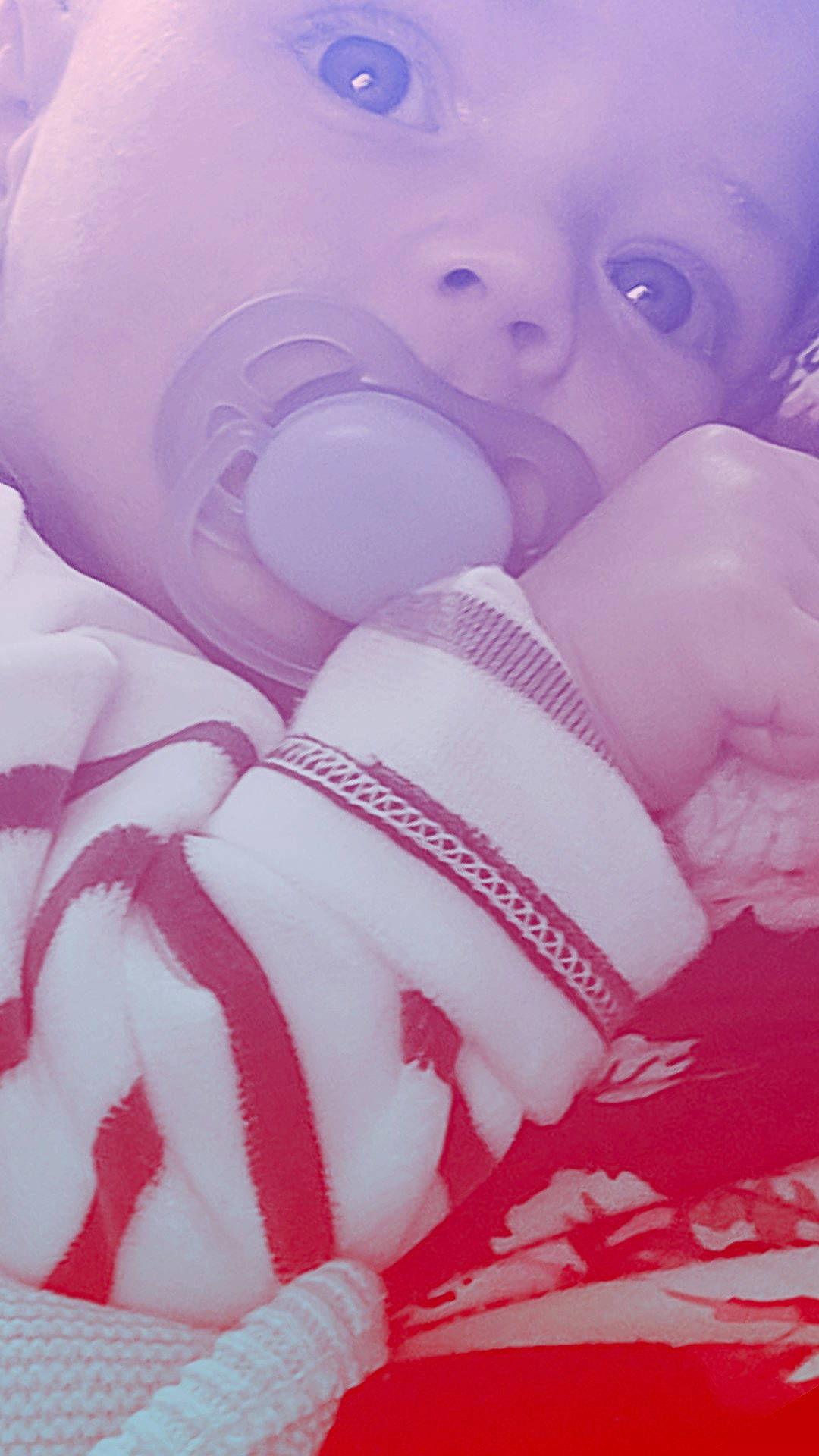 Ethan participe au concours pour gagner de l'argent avec cette photo : baby, baby_toddler_clothing, carmine, comfort, happy, human_leg, linens, magenta, nail, pattern, peach, person, petal, pink, purple, sweetness, textile, thumb, toddler, toy