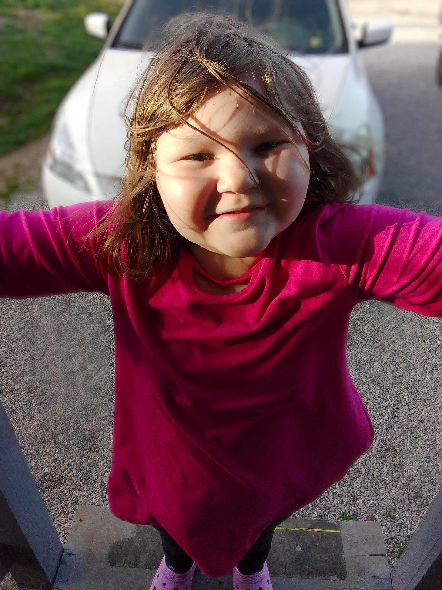 Aliyah joined the competition — help win amazing prizes! car, cheek, child, cool, face, facial_expression, family_car, fun, grass, happy, head, joy, leisure, magenta, mouth, person, pink, recreation, sitting, sleeve