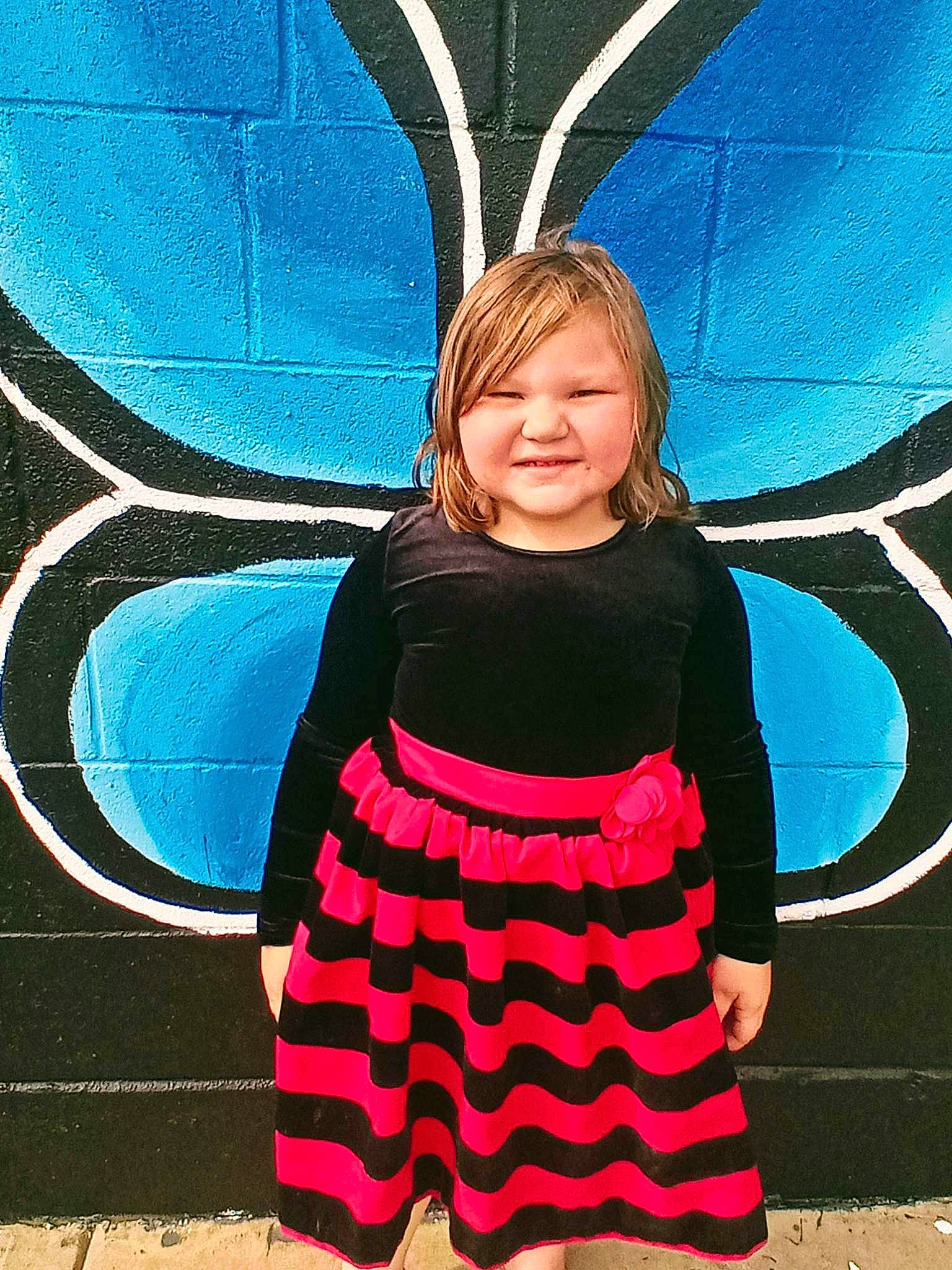 Aliyah is registered to the contest to win money with this photo: azure, baby_toddler_clothing, blue, cool, dress, electric_blue, eye, face, hair, hairstyle, happy, head, joy, one_piece_garment, pattern, person, sleeve, smile, symmetry, tints_and_shades