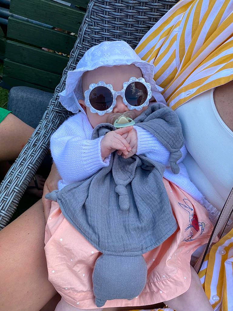 Eadie joined the competition — help win amazing prizes! baby_products, beard, chest, doll, electric_blue, eyewear, facial_hair, glasses, goggles, grass, moustache, person, personal_protective_equipment, pink, plush, sitting, stuffed_toy, sunglasses, textile, toy
