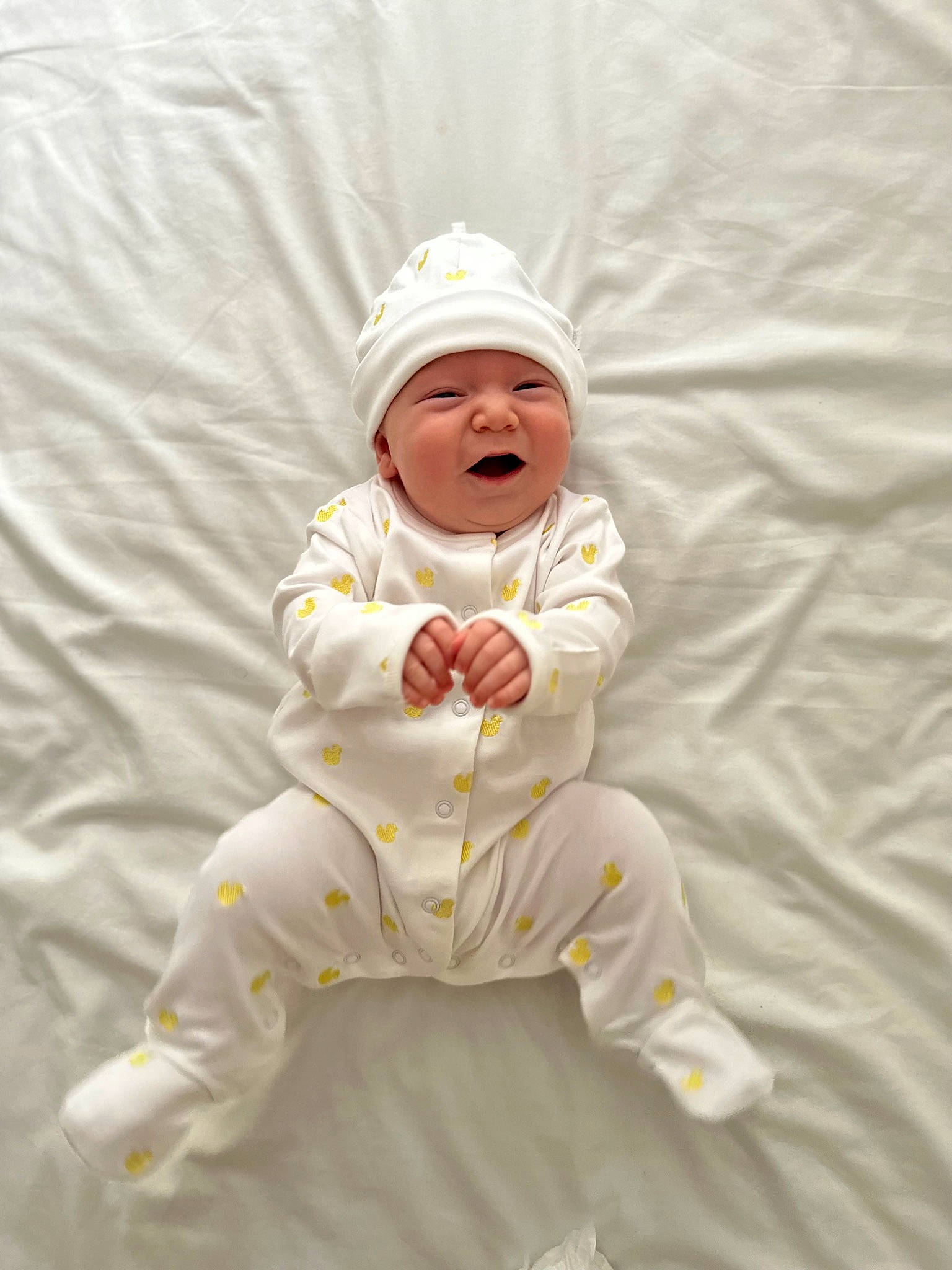 Eadie is registered to the contest to win money with this photo: art, baby, baby_toddler_clothing, cap, child, comfort, foot, happy, hat, head, headwear, illustration, linens, person, sitting, sleeve, smile, toddler