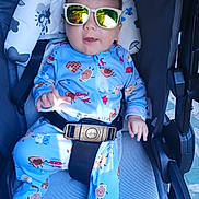 Asher joined the competition — help win amazing prizes! baby, sunglasses, stroller, blue_onesie, infant, seatbelt, reflection, smiling, child, cute, outdoor, fabric, pattern, playful, comfort, young, person, portrait, seat, clothing