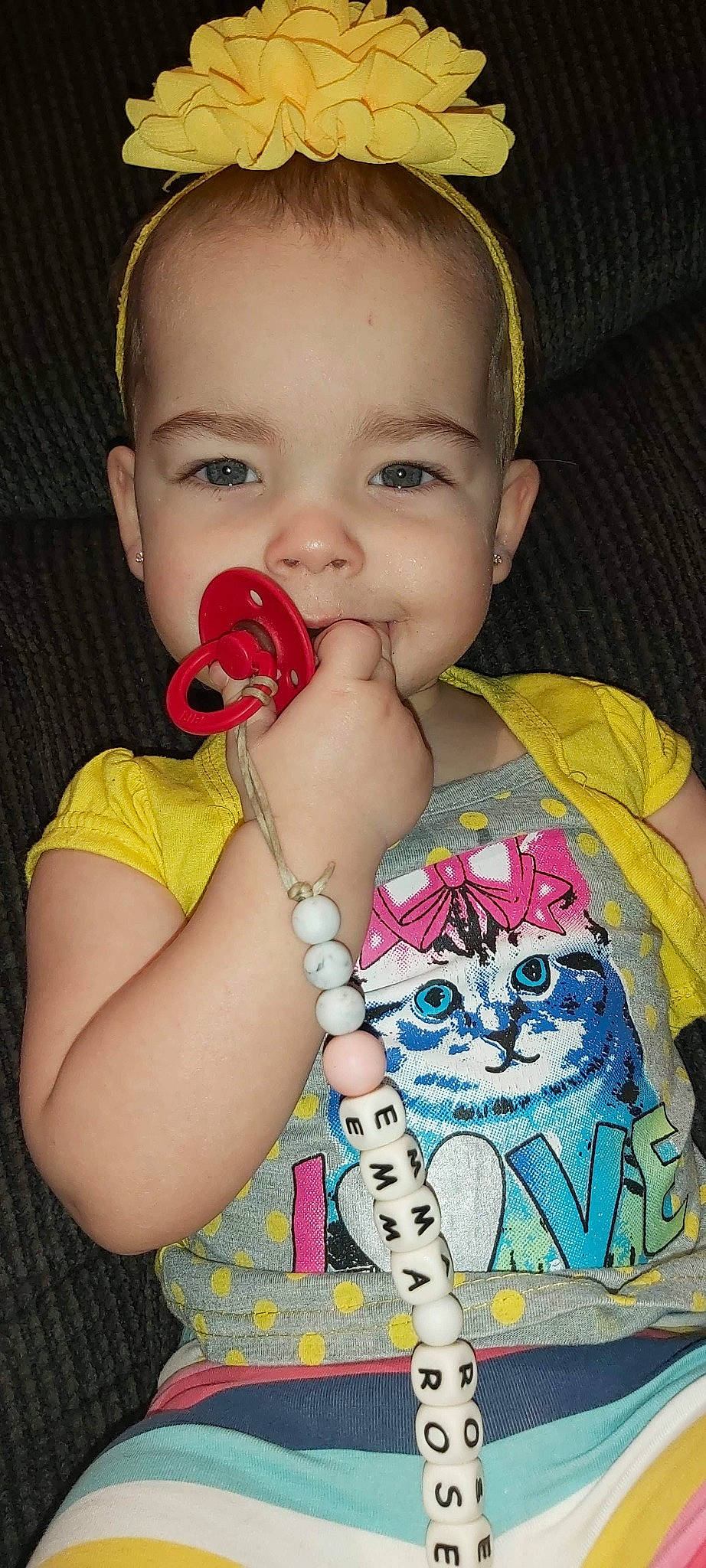 Emma-rose Marcotte participe au concours pour gagner de l'argent avec cette photo : arm, baby_toddler_clothing, cat, cheek, eye, eyelash, finger, gesture, hand, happy, head, iris, lip, mouth, neck, nose, organ, person, skin, sleeve