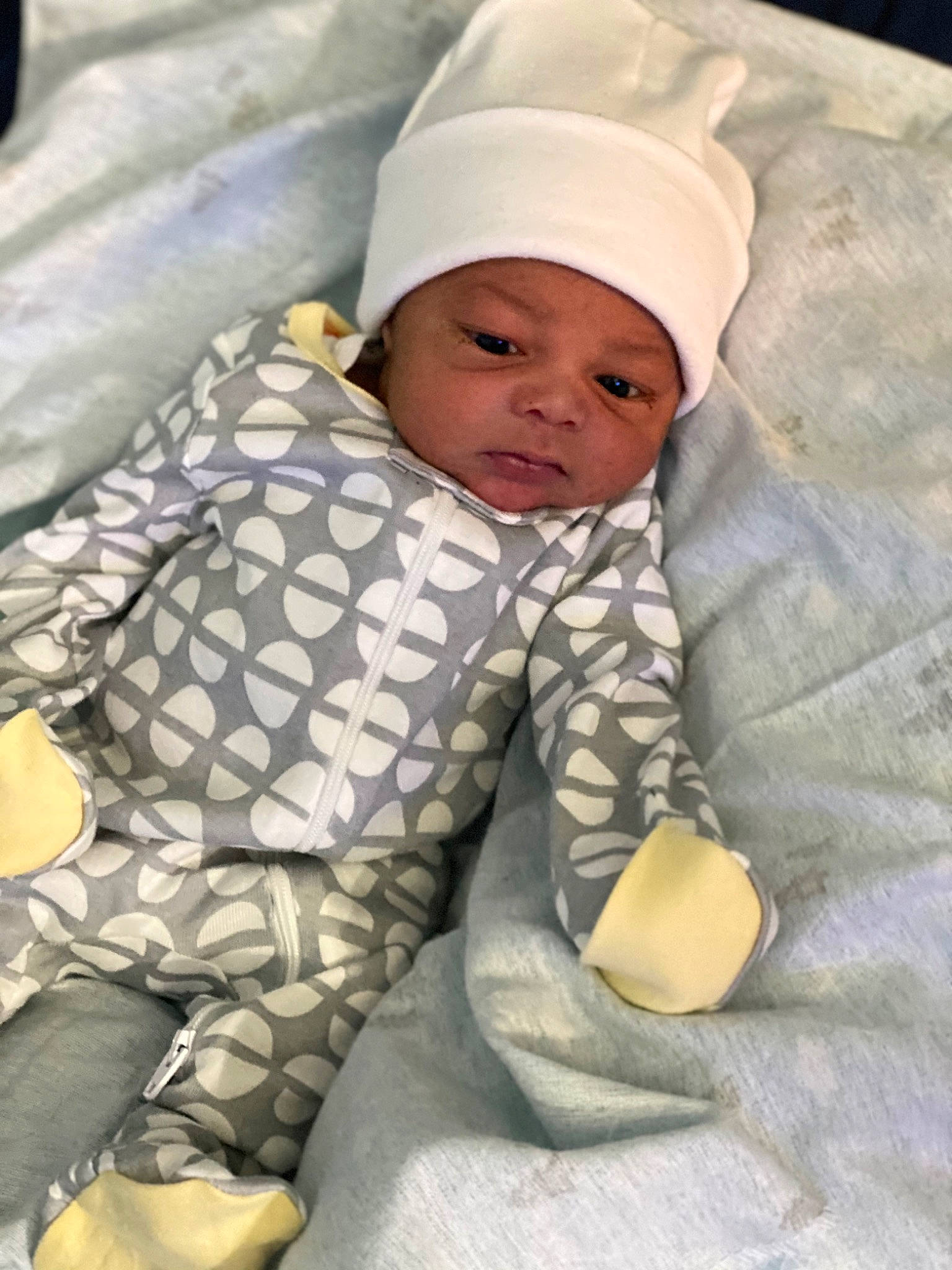 Davion is registered to the contest to win money with this photo: baby, baby_products, baby_safety, baby_sleeping, baby_toddler_clothing, beanie, bed_sheet, bedding, bedtime, cap, child, comfort, headwear, knit_cap, linens, nap, pattern, person, room, sleeve