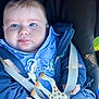 baby, blue_eyes, car_seat, child, clothing, cute, face, giraffe_toy, hand, hoodie, infant, jeans, pacifier_clip, person, plush_toy, seatbelt, smile, toy, young_child, zipper