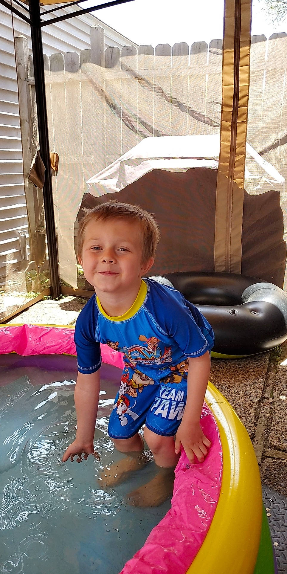 Ricky is registered to the contest to win money with this photo: baby_toddler_clothing, barefoot, child, face, fun, happy, joy, leisure, people, person, play, recreation, red, sitting, smile, summer, t_shirt, thigh, toddler, vacation