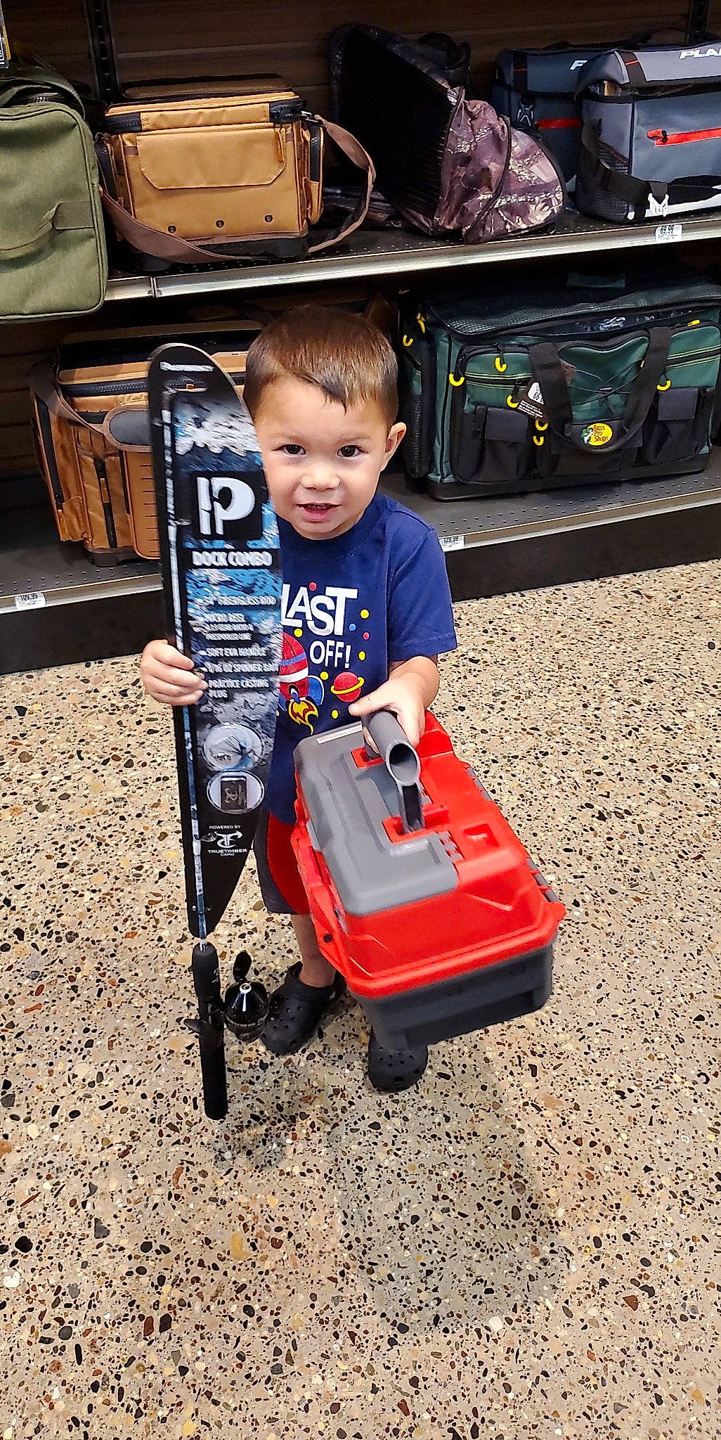 Grayson joined the competition — help win amazing prizes! auto_part, automotive_design, automotive_tire, baby_carriage, child, fun, machine, motor_vehicle, orange, person, play, recreation, riding_toy, rolling, sitting, smile, t_shirt, tire, toddler, toy_vehicle