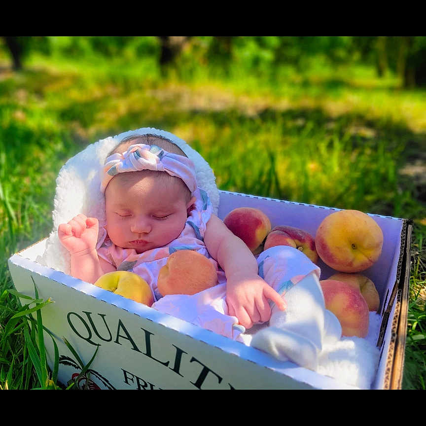 Amariah joined the competition — help win amazing prizes! baby, blanket, box, child, cute, daylight, fresh, fruit, grass, headband, infant, nature, outdoor, peaceful, peach, portrait, resting, sleeping, soft, summer