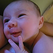 Amariah joined the competition — help win amazing prizes! baby, infant, smile, face, hand, fingers, skin, closeup, portrait, expression, cute, child, person, newborn, happy, indoors, human, toddler, soft_lighting, playful