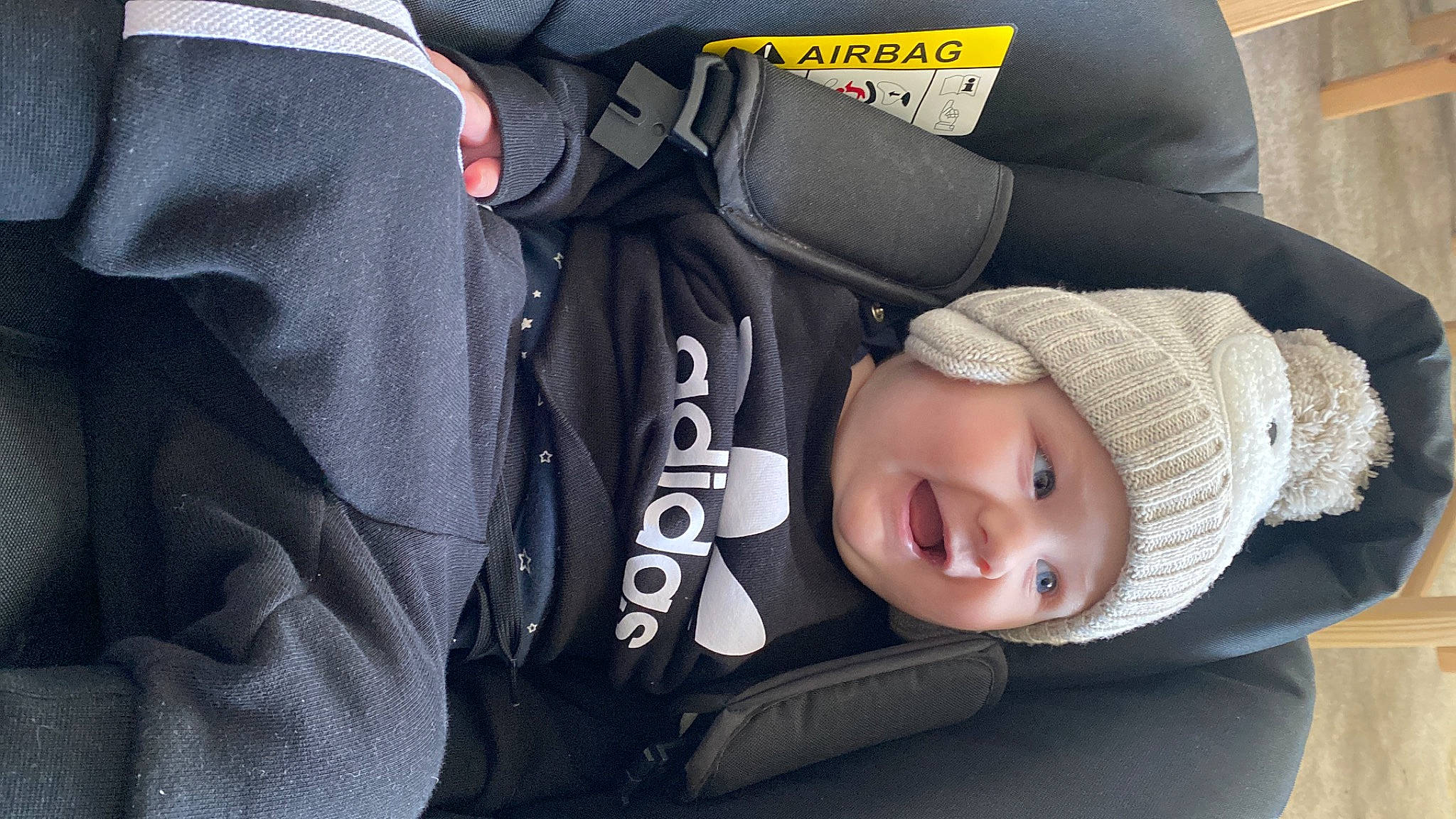 Atlas is registered to the contest to win money with this photo: auto_part, baby, baby_products, baby_toddler_clothing, beanie, cap, car_seat, child, comfort, electric_blue, hat, headwear, light, person, product, sitting, sleeve, smile, toddler, travel