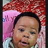 baby, child, face, portrait, indoor, striped_clothing, pink_cushion, red_blanket, curious_eyes, closeup, cute, infant, young_child, expression, cozy, soft_toys, person, skin, head, smiling