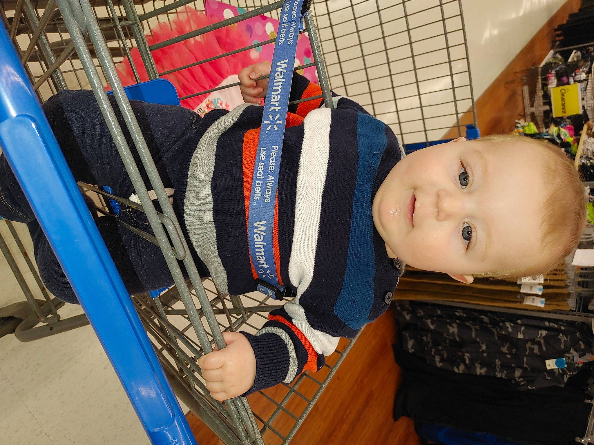 Laine is registered to the contest to win money with this photo: baby, baby_products, child, drawer, electric_blue, fashion_accessory, flooring, person, personal_protective_equipment, retail, room, shelf, toddler, toy, wood