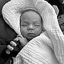 Ariana participe au concours pour gagner de l'argent avec cette photo : baby, black_and_white, blanket, closeup, cozy, cute, face, hands, infant, monochrome, newborn, peaceful, person, portrait, resting, sleeping, soft, texture, wrapped, young