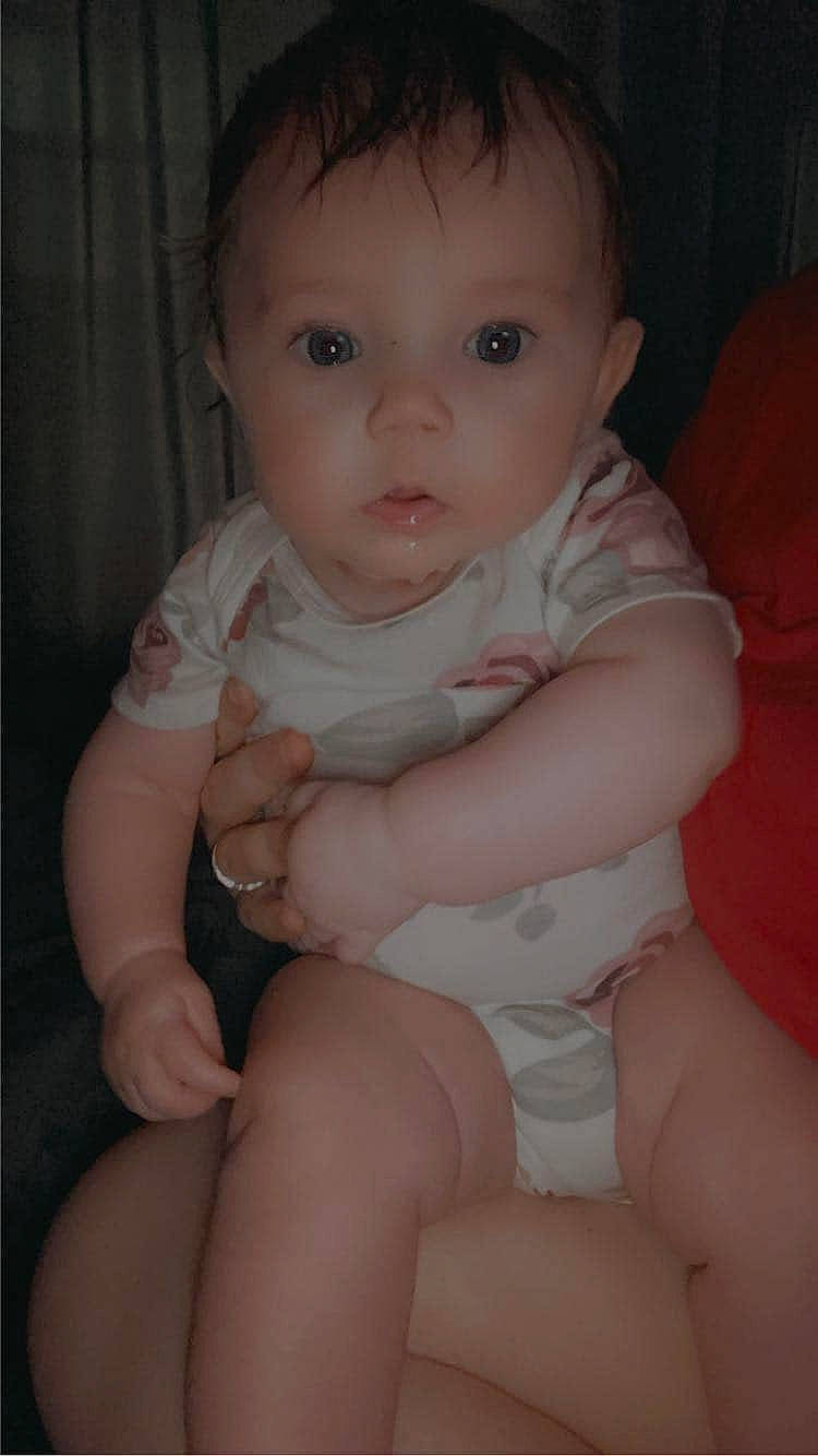 Autumn is registered to the contest to win money with this photo: baby, baby_toddler_clothing, cheek, chin, eye, eyelash, finger, hair, human_body, iris, jaw, leg, lip, mouth, neck, nose, organ, person, pink, skin