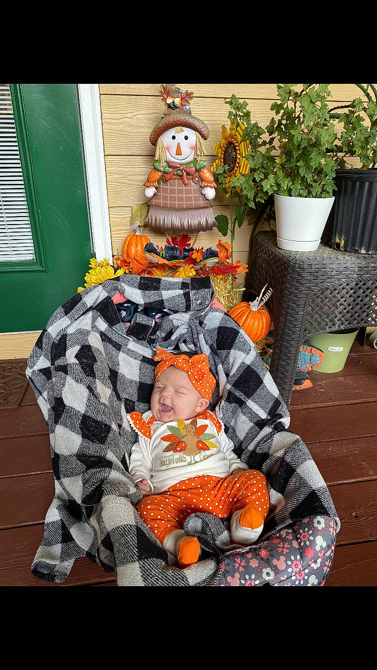 Kynleigh joined the competition — help win amazing prizes! art, baby, baby_carriage, baby_products, baby_toddler_clothing, child, costume, event, flowerpot, green, headwear, houseplant, lawn_ornament, orange, person, plant, sitting, stuffed_toy, textile, toddler